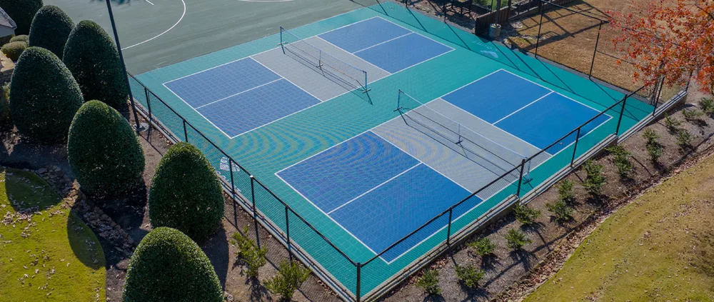 Outdoor pickleball court built with modular interlocking polypropylene sport tiles